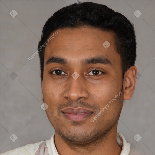 Joyful latino young-adult male with short  black hair and brown eyes