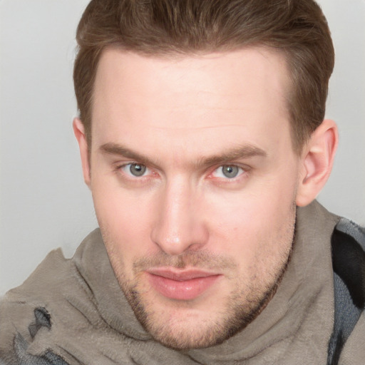 Joyful white adult male with short  brown hair and grey eyes