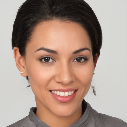 Joyful white young-adult female with medium  brown hair and brown eyes