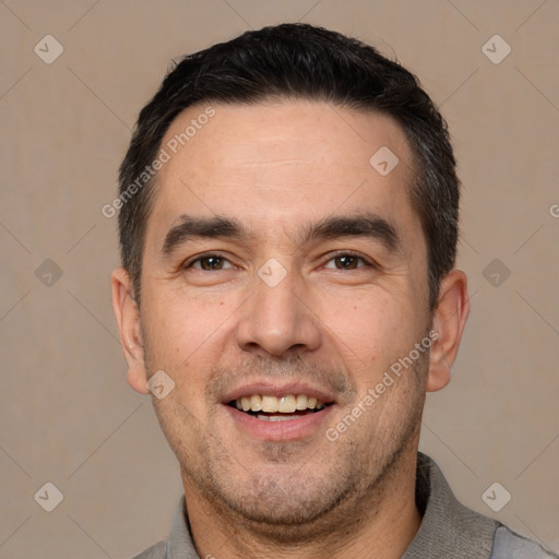 Joyful white adult male with short  black hair and brown eyes