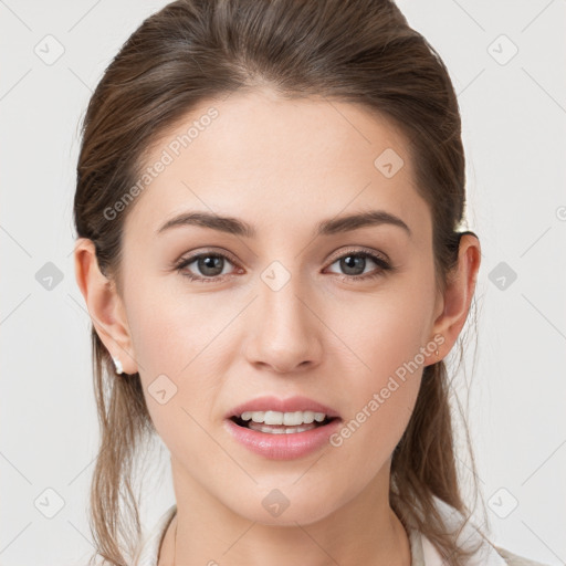 Joyful white young-adult female with long  brown hair and grey eyes