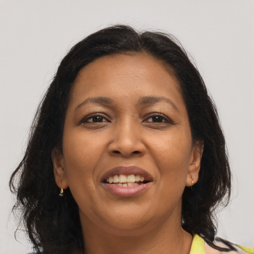 Joyful asian adult female with long  brown hair and brown eyes