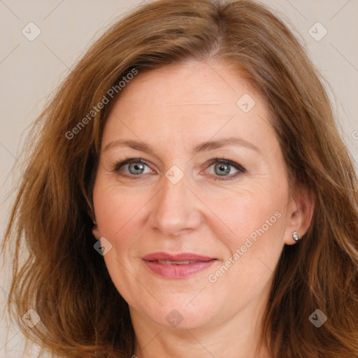 Joyful white adult female with long  brown hair and brown eyes