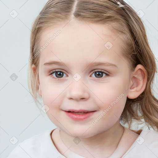 Joyful white child female with medium  brown hair and blue eyes