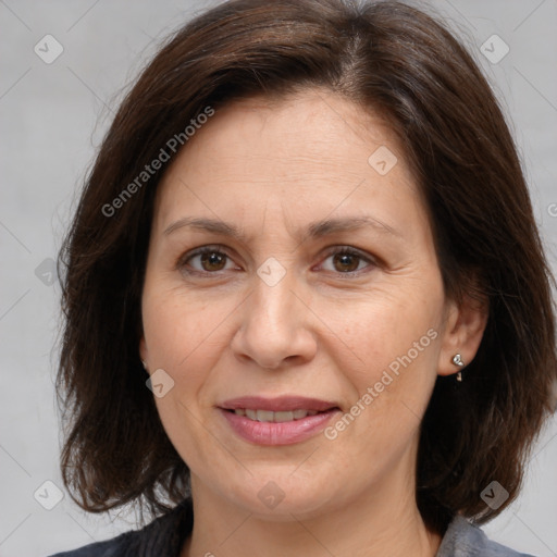 Joyful white adult female with medium  brown hair and brown eyes