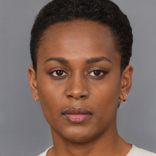 Neutral black young-adult female with short  brown hair and brown eyes