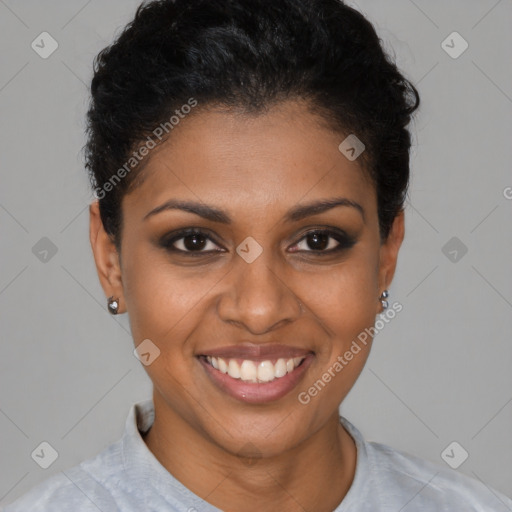 Joyful black young-adult female with short  brown hair and brown eyes