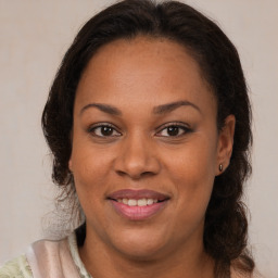 Joyful black young-adult female with medium  brown hair and brown eyes