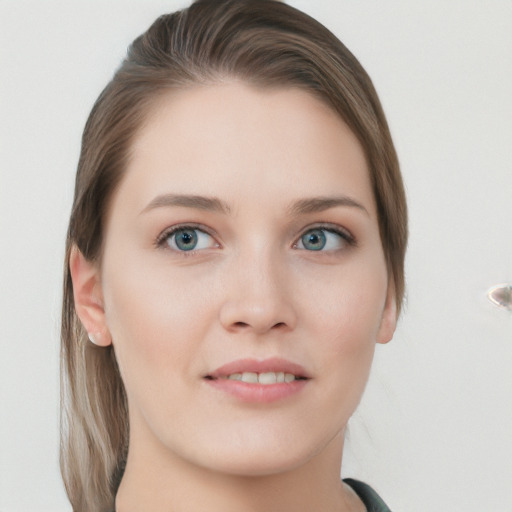 Joyful white young-adult female with long  brown hair and blue eyes