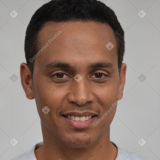 Joyful latino young-adult male with short  black hair and brown eyes