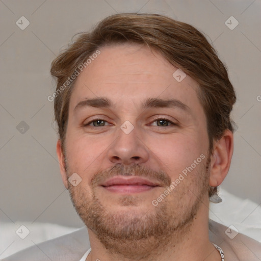 Joyful white adult male with short  brown hair and brown eyes