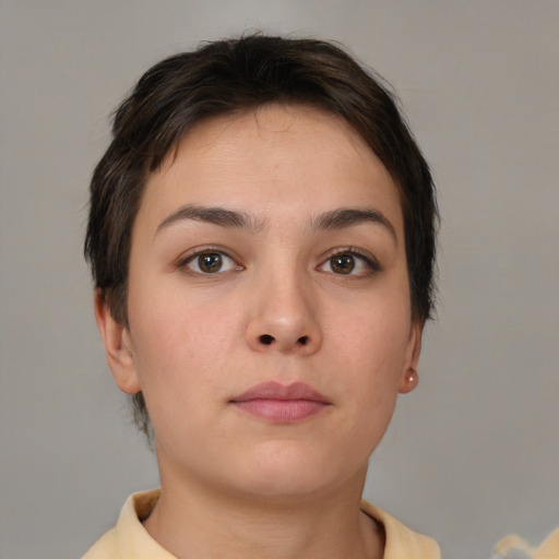 Neutral white young-adult female with short  brown hair and brown eyes