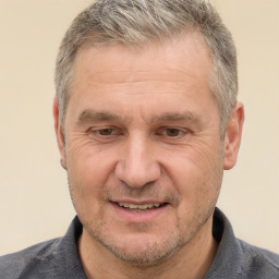 Joyful white middle-aged male with short  brown hair and brown eyes