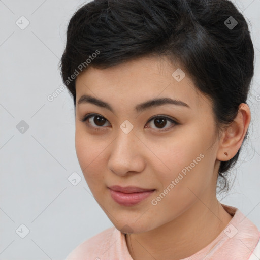 Joyful latino young-adult female with medium  brown hair and brown eyes