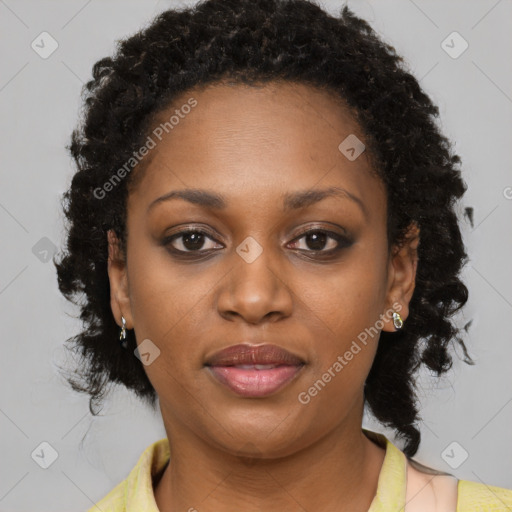 Joyful black young-adult female with medium  brown hair and brown eyes