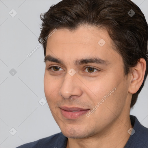 Joyful white adult male with short  brown hair and brown eyes