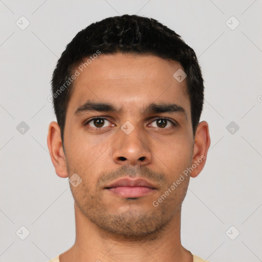 Neutral latino young-adult male with short  black hair and brown eyes