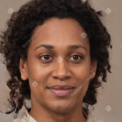 Joyful black adult female with medium  brown hair and brown eyes