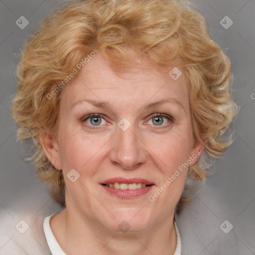 Joyful white adult female with medium  brown hair and blue eyes