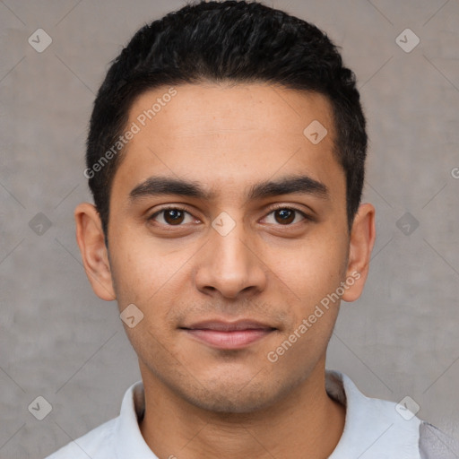 Joyful latino young-adult male with short  black hair and brown eyes