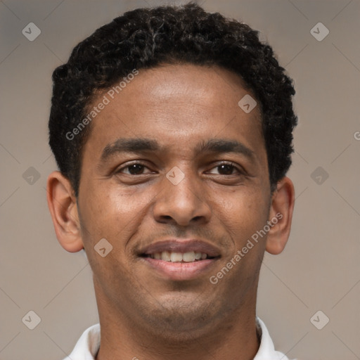 Joyful latino young-adult male with short  brown hair and brown eyes