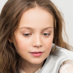 Joyful white child female with long  brown hair and brown eyes