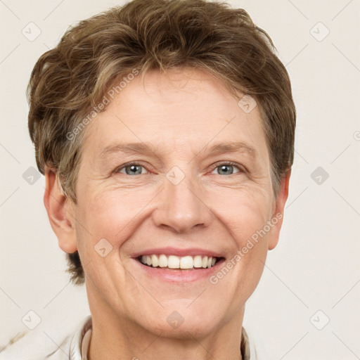 Joyful white adult female with short  brown hair and grey eyes