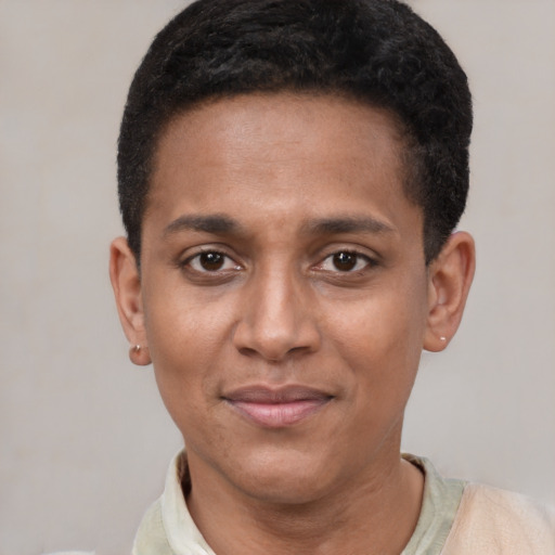 Joyful black young-adult male with short  black hair and brown eyes