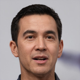 Neutral white adult male with short  black hair and brown eyes