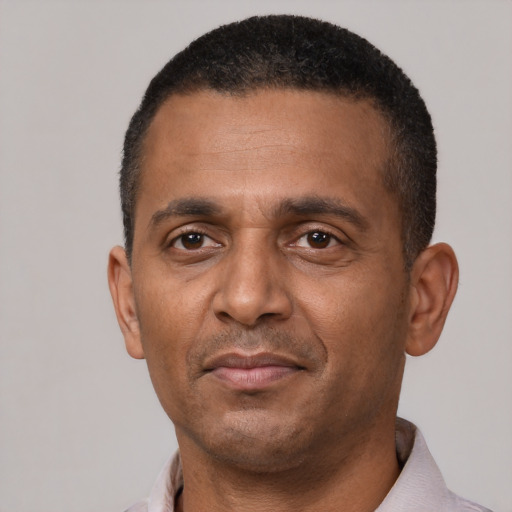 Neutral black adult male with short  black hair and brown eyes
