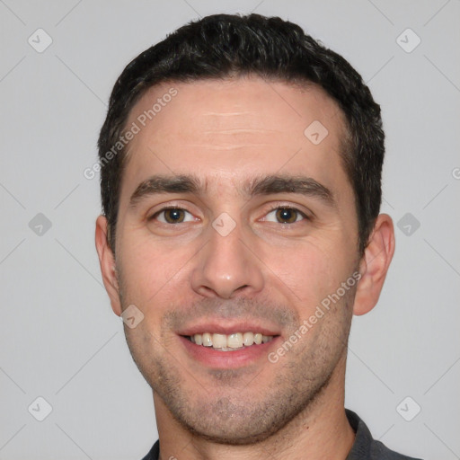 Joyful white young-adult male with short  black hair and brown eyes