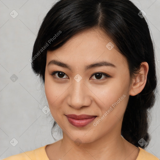 Joyful latino young-adult female with medium  brown hair and brown eyes