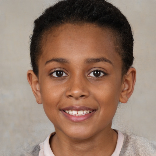 Joyful black child female with short  brown hair and brown eyes