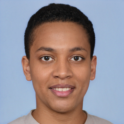 Joyful latino young-adult male with short  brown hair and brown eyes