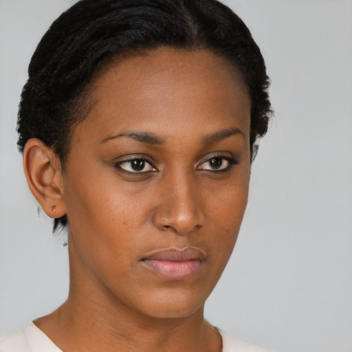 Neutral black young-adult female with short  brown hair and brown eyes