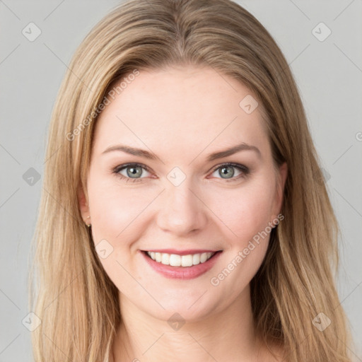 Joyful white young-adult female with long  brown hair and green eyes