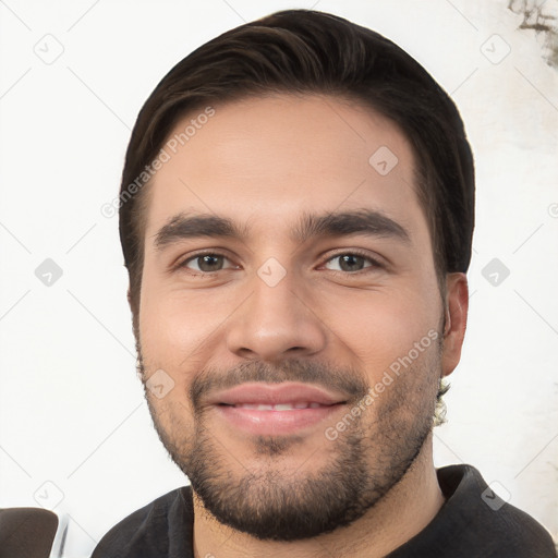 Joyful white young-adult male with short  black hair and brown eyes