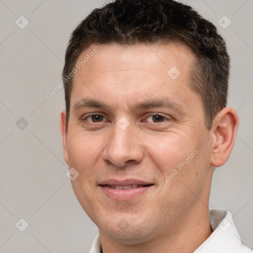 Joyful white adult male with short  brown hair and brown eyes