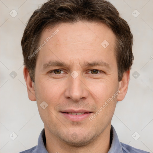 Joyful white adult male with short  brown hair and grey eyes