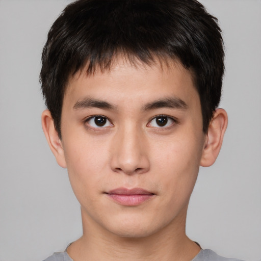 Neutral asian young-adult male with short  brown hair and brown eyes