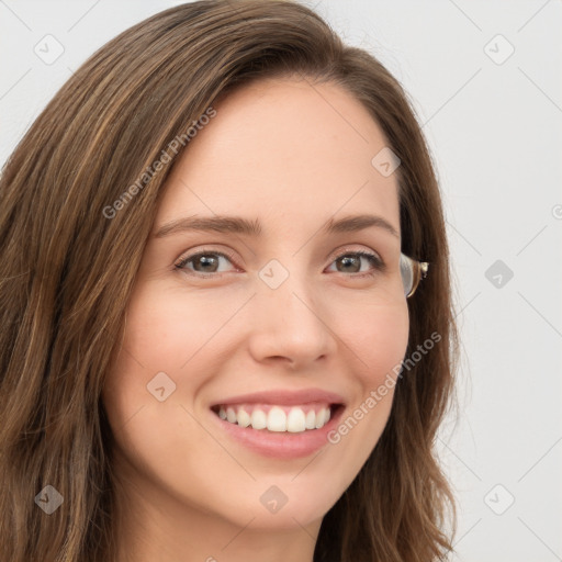 Joyful white young-adult female with long  brown hair and green eyes