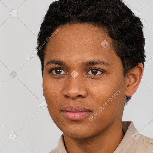 Joyful black young-adult male with short  black hair and brown eyes