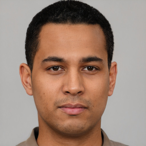 Neutral latino young-adult male with short  black hair and brown eyes