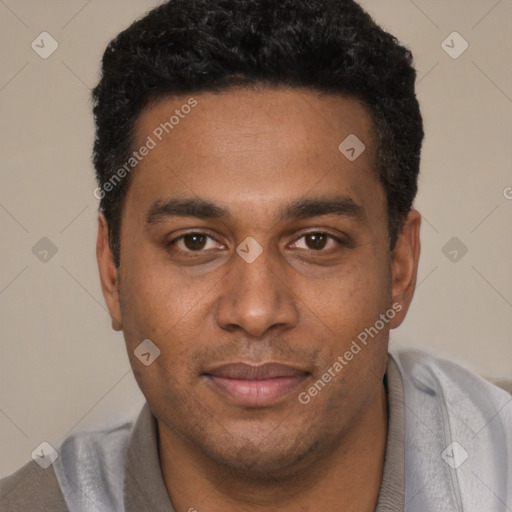 Joyful black young-adult male with short  black hair and brown eyes