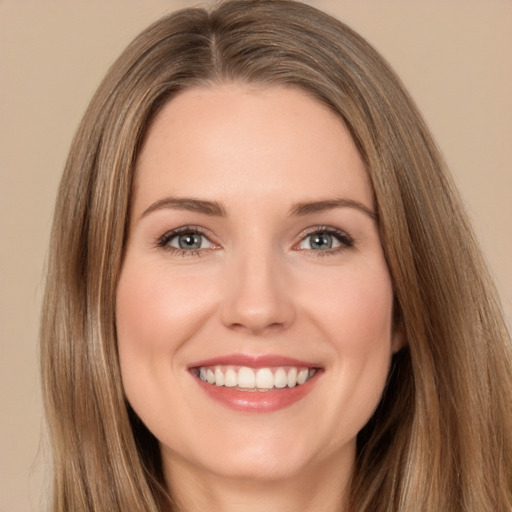 Joyful white young-adult female with long  brown hair and brown eyes