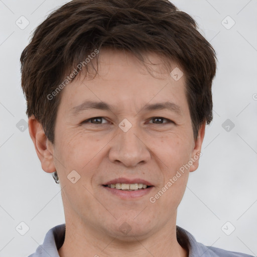 Joyful white adult male with short  brown hair and brown eyes