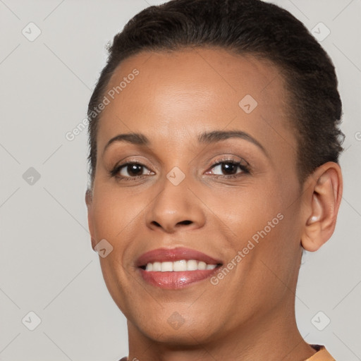 Joyful white young-adult female with short  brown hair and brown eyes