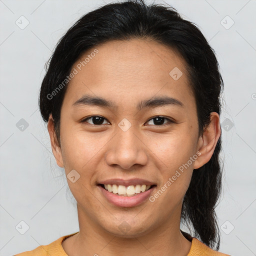 Joyful asian young-adult female with medium  brown hair and brown eyes