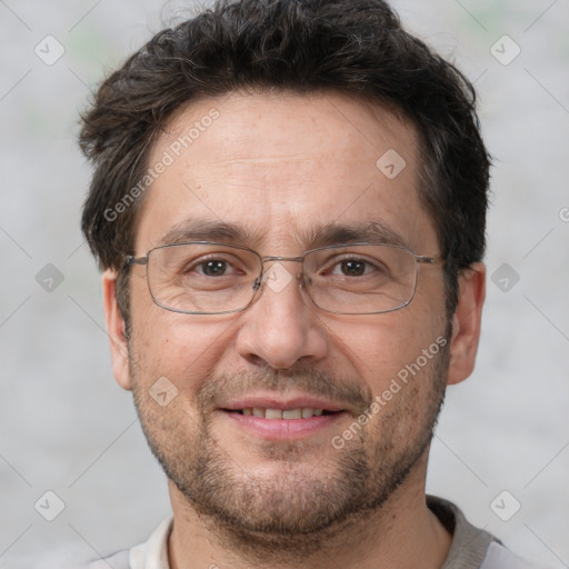 Joyful white adult male with short  brown hair and brown eyes