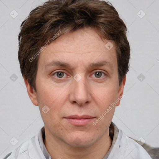 Joyful white adult male with short  brown hair and grey eyes